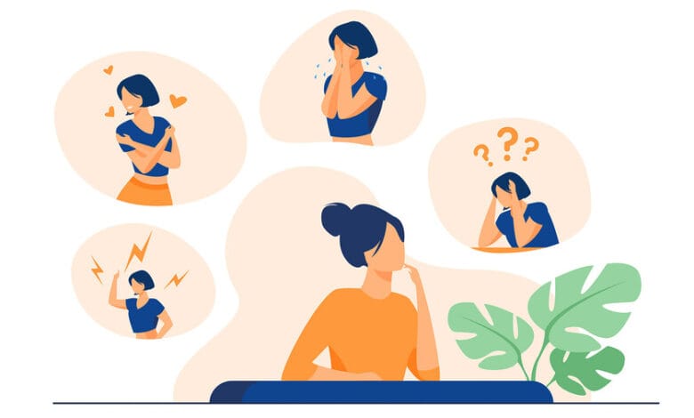Una persona con la cabeza entre las manos, rodeada de emociones confusas