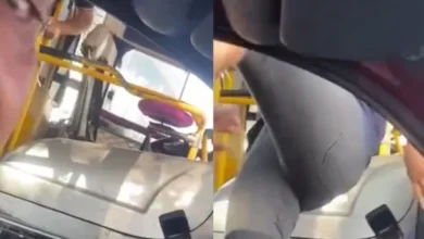 Chofer de colectivo y conductor de auto discutiendo en la calle