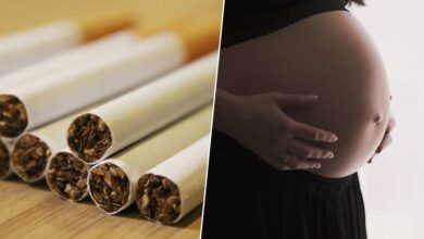 Una mujer embarazada sosteniendo un cigarro apagado, simbolizando el impacto del tabaco en la fertilidad